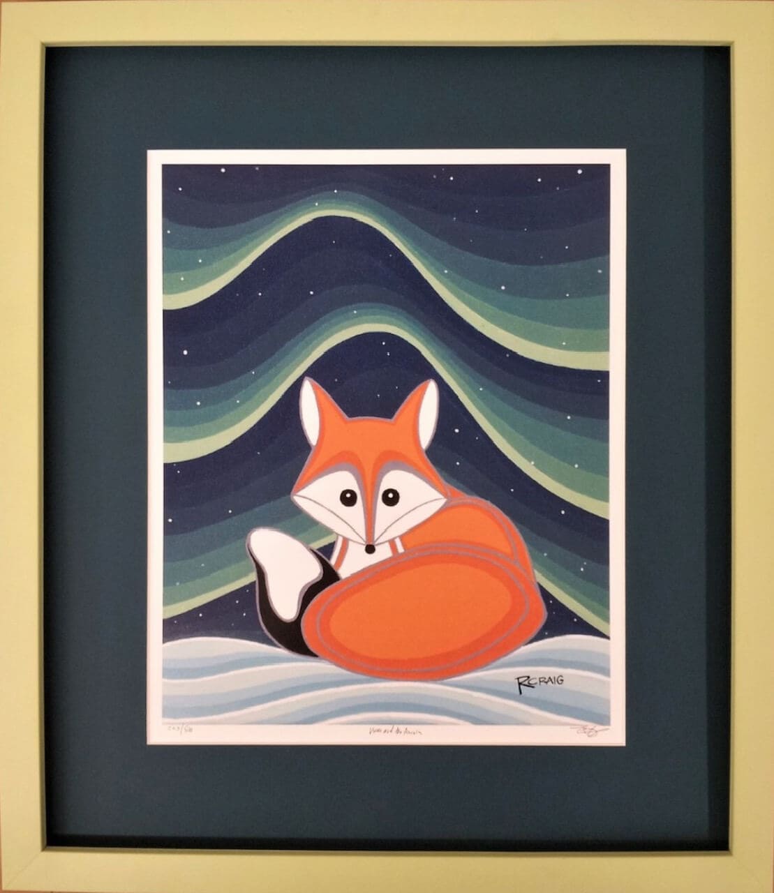 A framed print of a fox in the snow.