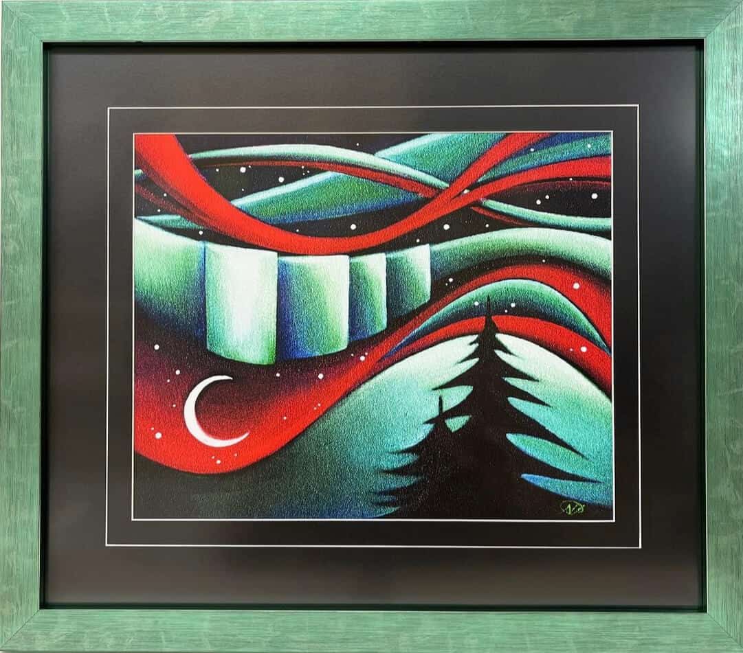 A green frame with a painting of a tree and moon in a night sky.