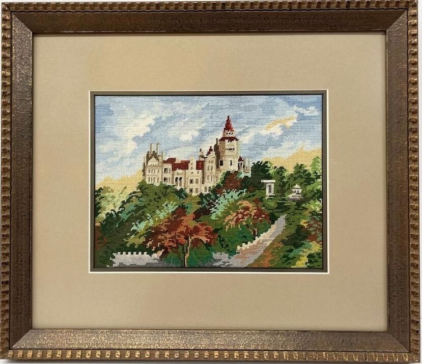 Castle in a gold frame.