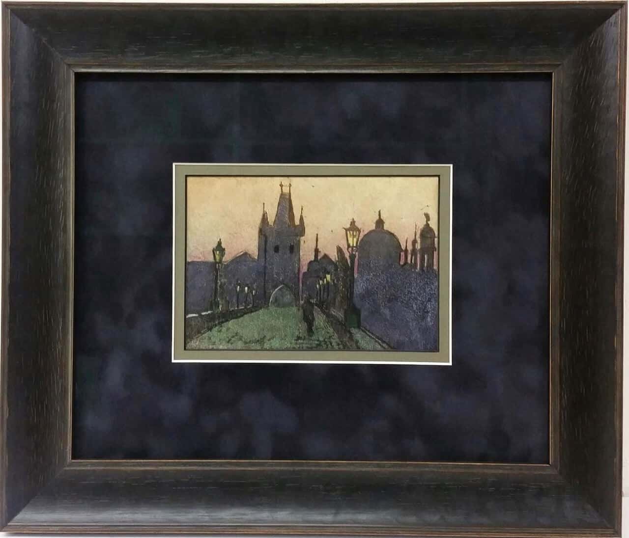 A framed painting of the charles bridge in prague.